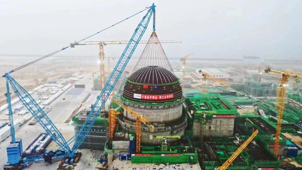 Nuclear reactor construction project in China with cranes and workers