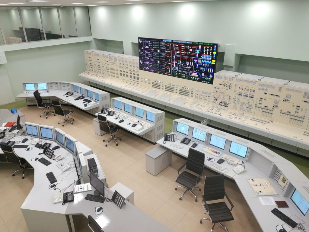 Advanced nuclear reactor control room with digital monitoring systems.