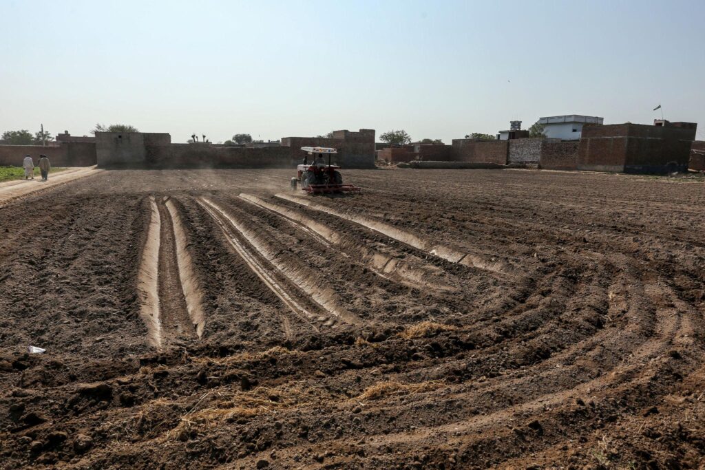 Dry farmland and water shortage conditions in Pakistan during extreme summer temperatures.