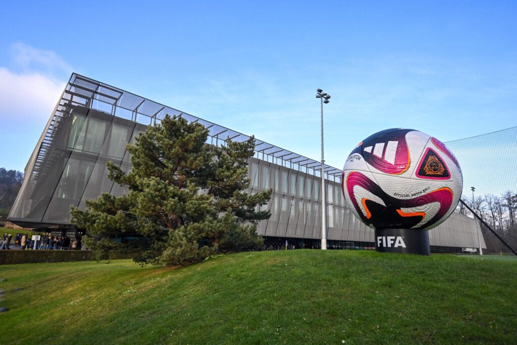 FIFA officials discussing World Cup 2026 preparations and squad registration process