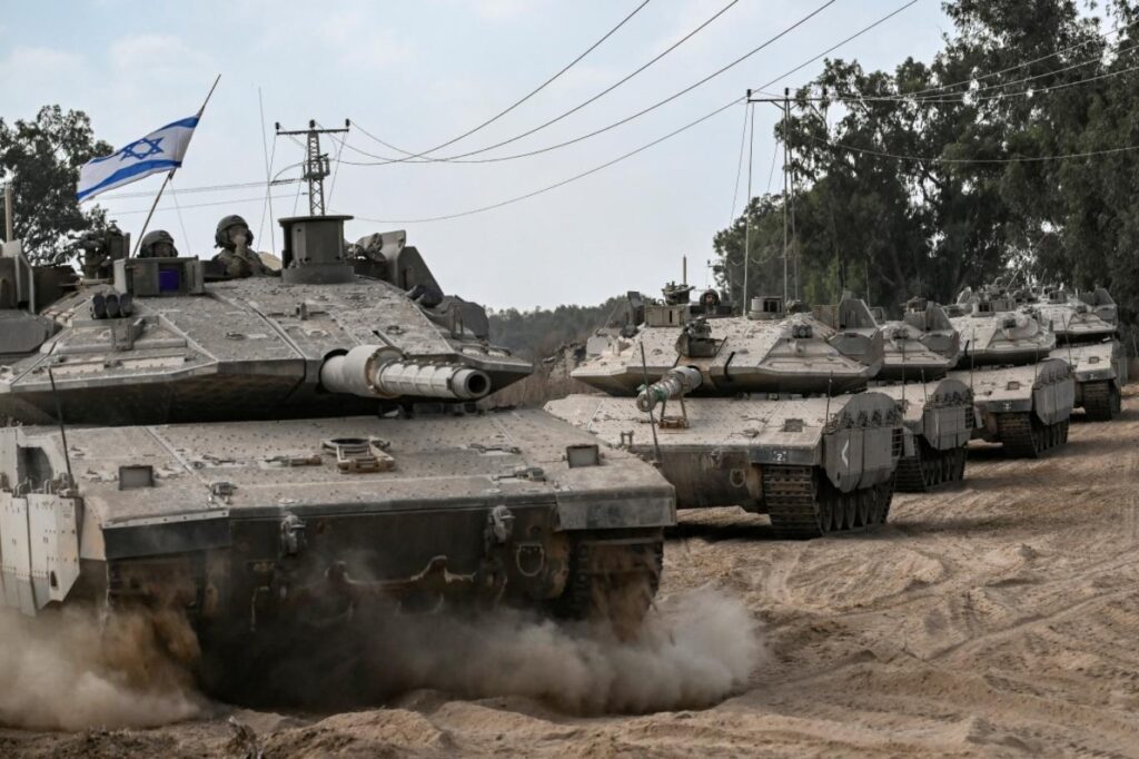 Israeli military deploying artillery and armored vehicles during conflict operations
