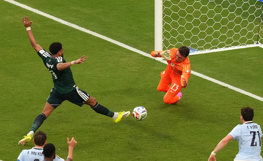 Saudi Arabia defender Abdulelah Alamri scores against Uruguay goalkeeper Fernando Muslera during FIFA World Cup 2026 Group H match