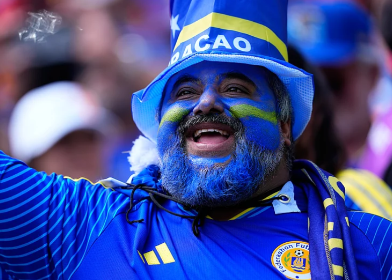 Curacao fans cheer before FIFA World Cup 2026 match against Ivory Coast