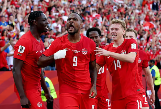 Cyle Larin celebrates after scoring Canada
