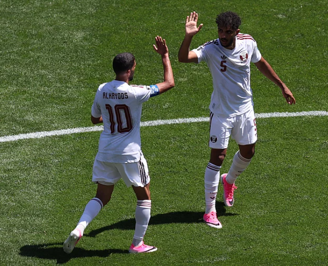 Hassan Al-Haydos celebrates after scoring for Qatar against Bosnia