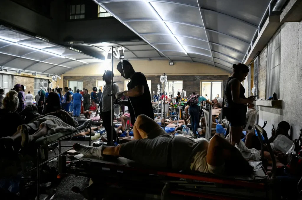Patients receive emergency medical treatment at an overcrowded field hospital in La Guaira after Venezuela