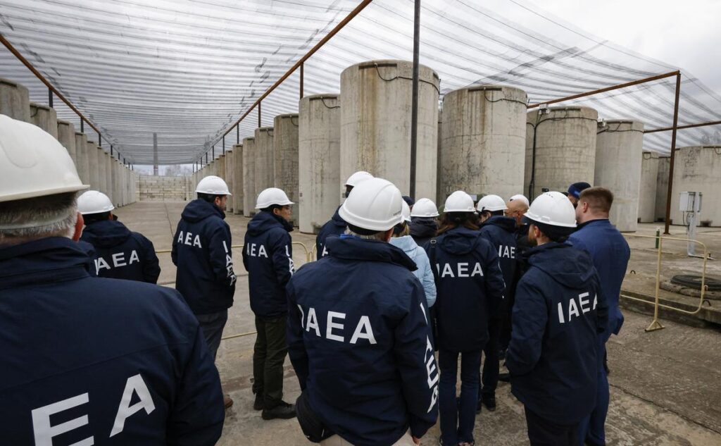 International inspectors monitoring a nuclear facility.