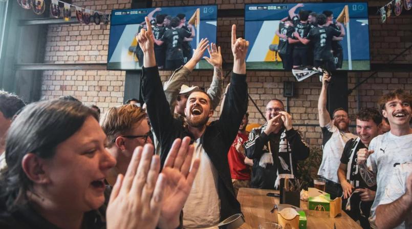 New Zealand fans celebrate after the All Whites score against Iran during FIFA World Cup 2026