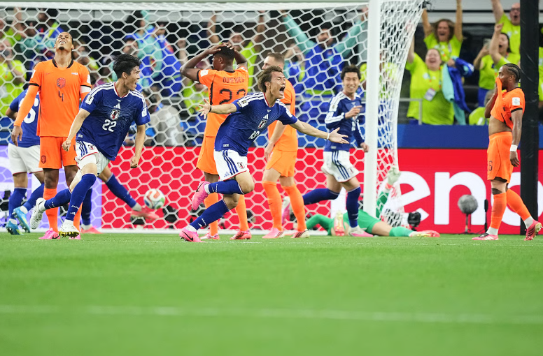 Japan players Koki Ogawa and Takehiro Tomiyasu celebrate after Japan scored against the Netherlands during the FIFA World Cup 2026 Group F match