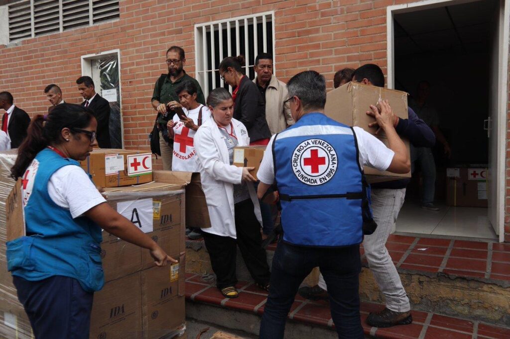 Volunteers from the Venezuelan Red Cross unload humanitarian aid supplies for earthquake survivors following the devastating twin earthquakes.