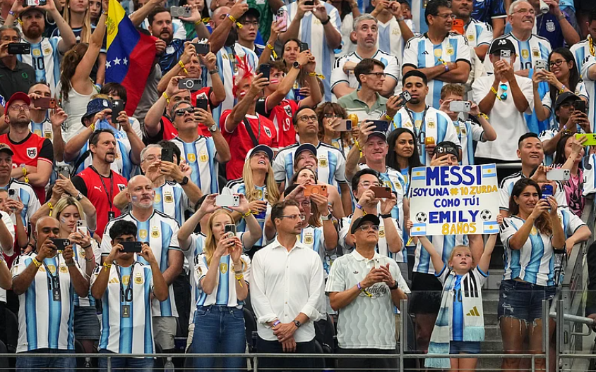 Argentina fans hold a Lionel Messi sign during FIFA World Cup 2026 Group J match