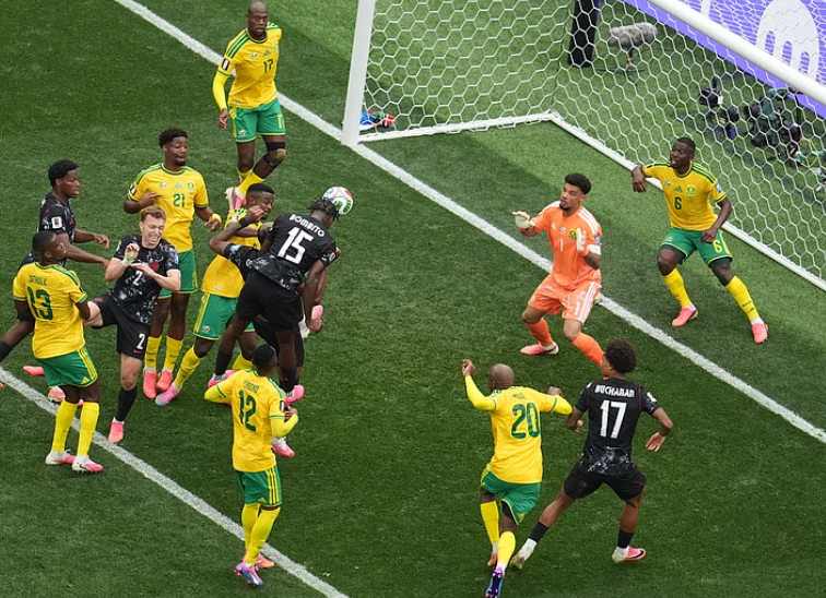 Canada defender Moise Bombito attempts to score against South Africa during FIFA World Cup 2026 Round of 32