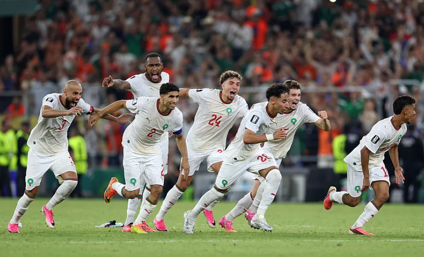 Morocco players celebrate after defeating Netherlands on penalties in FIFA World Cup 2026 Round of 32