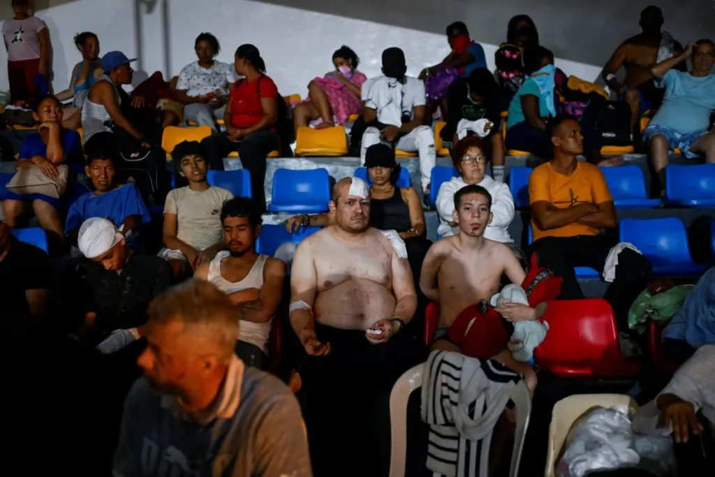 Earthquake survivors, including injured residents, wait for treatment at a temporary field hospital in La Guaira after the devastating Venezuela earthquakes.