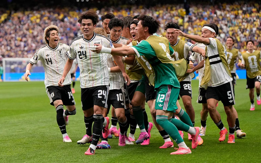 Japan players celebrate after Kaishu Sano scores against Brazil in FIFA World Cup 2026 Round of 32
