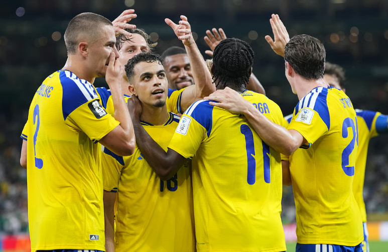 Yasin Ayari celebrates with Sweden teammates after scoring Sweden