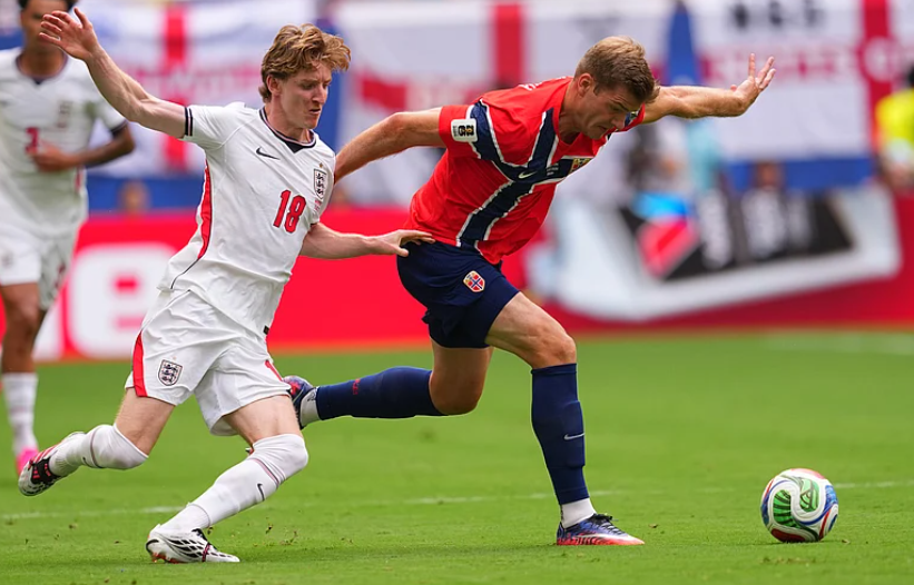Norway striker Alexander Sørloth shields the ball from England winger Anthony Gordon during the World Cup quarterfinal