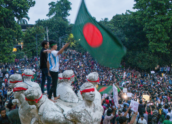 Bangladesh protesters wave the national flag during the 2024 student-led movement against government job quotas