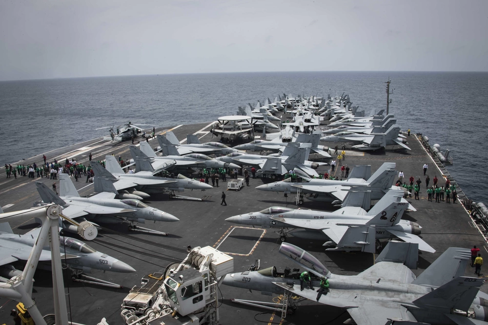 US Launches Heavy Airstrikes on Iran After Missile Attacks, Raising Fears of Wider Middle East War Military aircraft parked on the flight deck of the USS Harry S. Truman aircraft carrier at sea