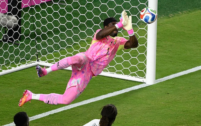 Ghana goalkeeper Lawrence Ati-Zigi makes a diving save against Colombia during the FIFA World Cup 2026 Round of 32
