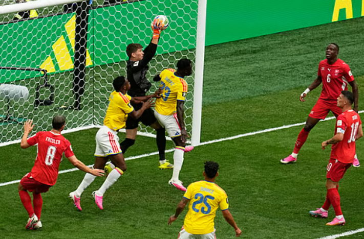 Switzerland goalkeeper Gregor Kobel makes a save against Colombia during the FIFA World Cup 2026 Round of 16
