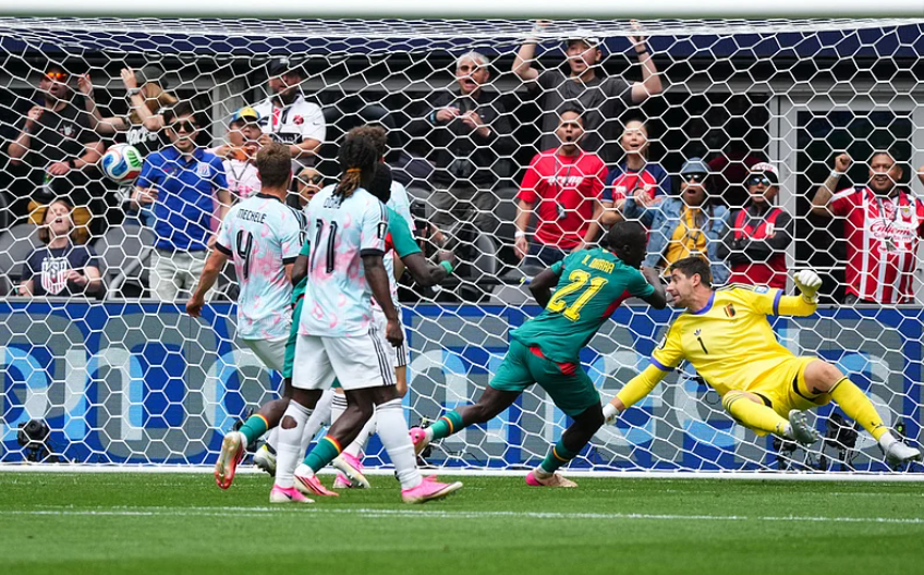 Senegal midfielder Habib Diarra scores against Belgium goalkeeper Thibaut Courtois in the FIFA World Cup 2026 Round of 32