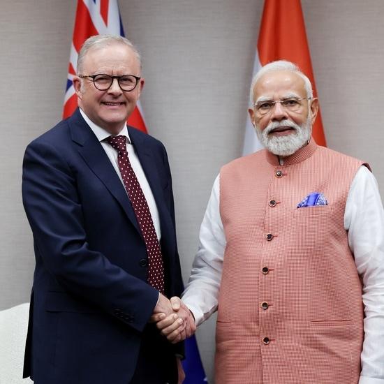Narendra Modi and Anthony Albanese shaking hands during India–Australia talks on uranium cooperation