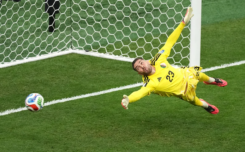 Algeria goalkeeper Luca Zidane dives as Switzerland score their second goal in the FIFA World Cup 2026 Round of 32