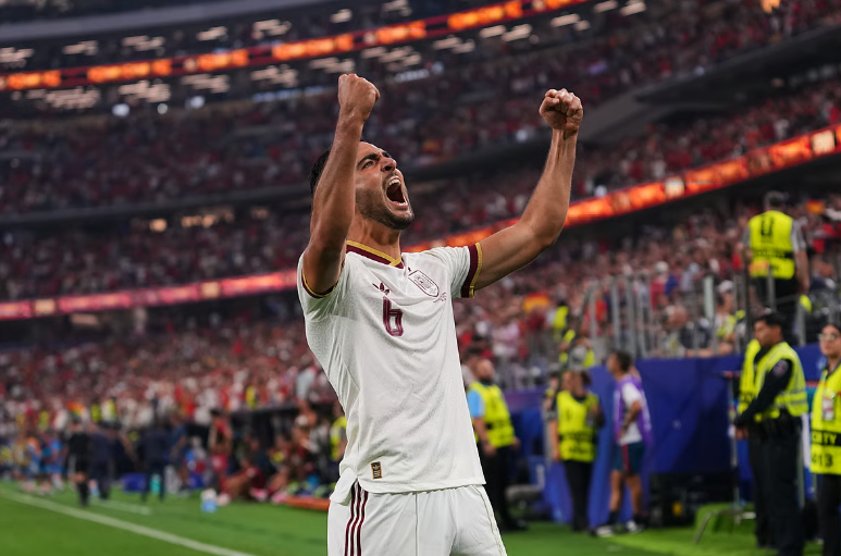 Mikel Merino celebrates after scoring Spain