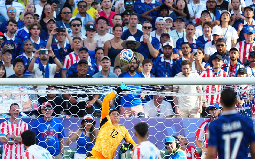 Paraguay goalkeeper Orlando Gill makes a save against France during the FIFA World Cup 2026 Round of 16