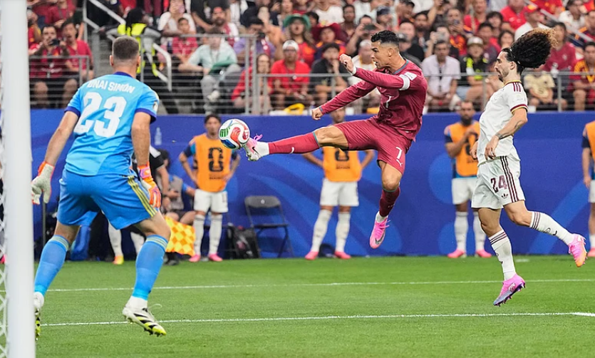 Cristiano Ronaldo shoots against Spain during Portugal