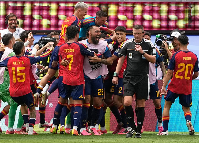 Spain players celebrate after Mikel Merino scored the winning goal against Belgium during the FIFA World Cup 2026 quarterfinal