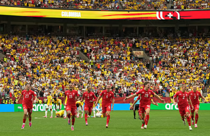 Switzerland players celebrate after defeating Colombia in a penalty shootout at the FIFA World Cup 2026