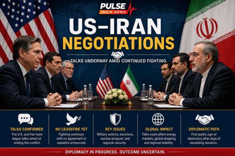 US and Iranian representatives seated across a negotiation table beneath the US and Iran flags, with a headline stating that talks are underway amid continued fighting.