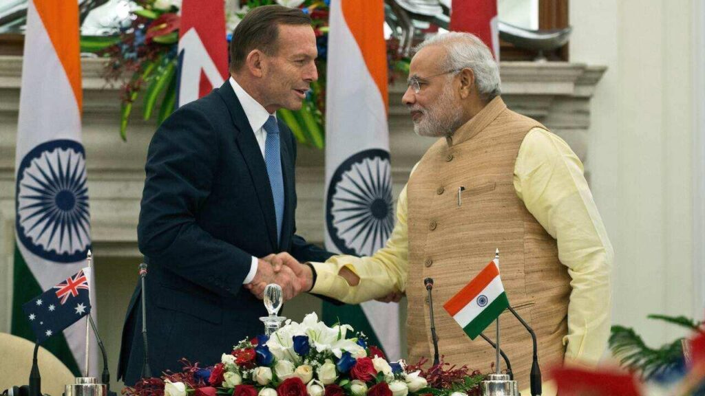 India and Australia flags at a commercial port representing uranium exports and growing bilateral trade