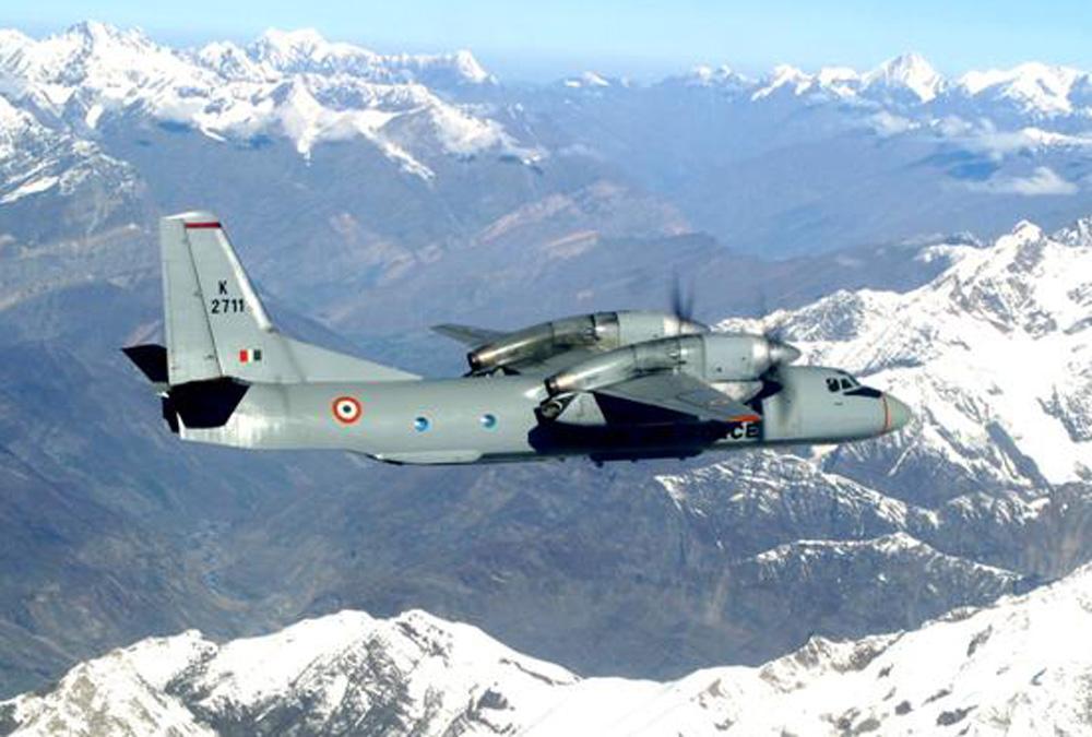 Indian Air Force An-32 transport aircraft flying over Himalayan terrain