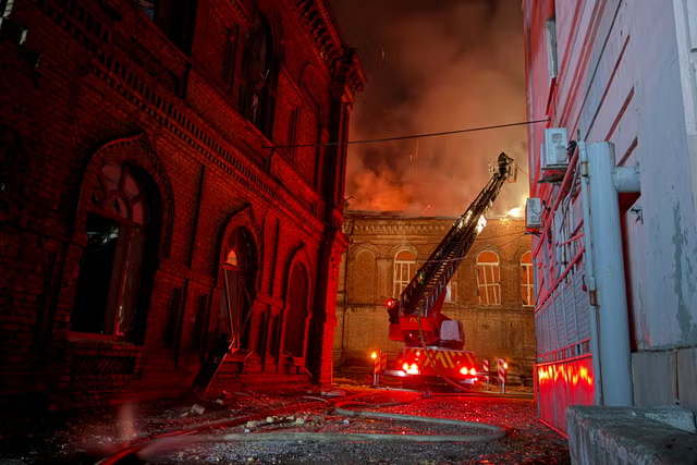 Ukrainian firefighters battle a fire at Zaporizhzhia National University after a Russian drone strike on September 21, 2026.