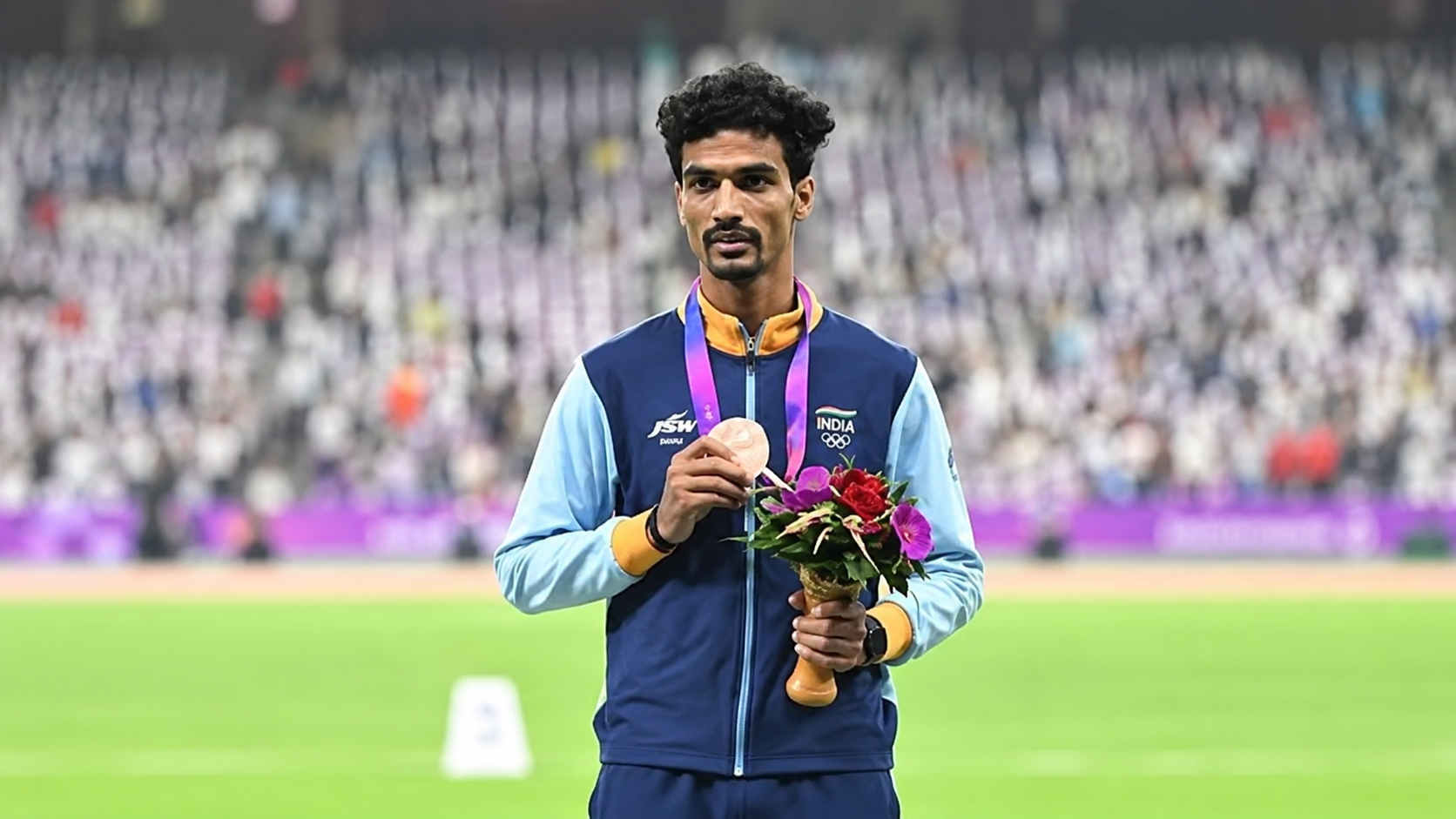 Gulveer Singh celebrates after winning silver in the men’s 10,000m at the Asian Games 2026