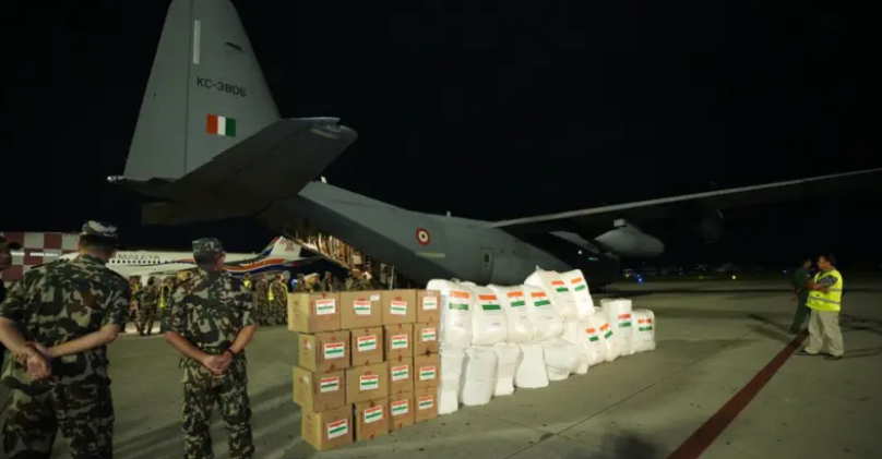 Indian relief supplies are unloaded from a military transport aircraft during flood-assistance operations for Nepal