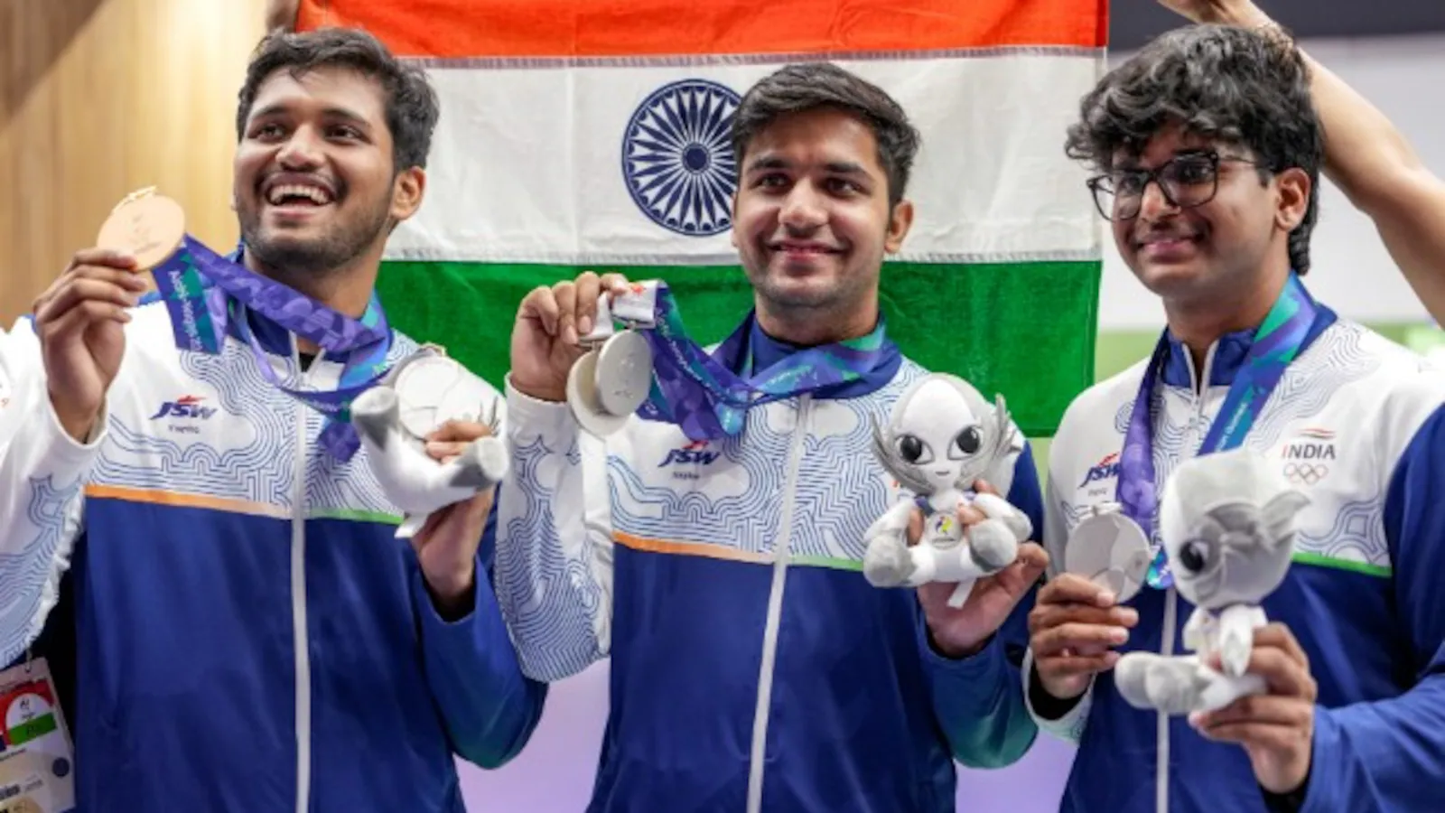 Indian shooters Rudrankksh Patil, Himanshu Dhillon and Parth Rakesh Mane celebrate with their Asian Games 2026 medals