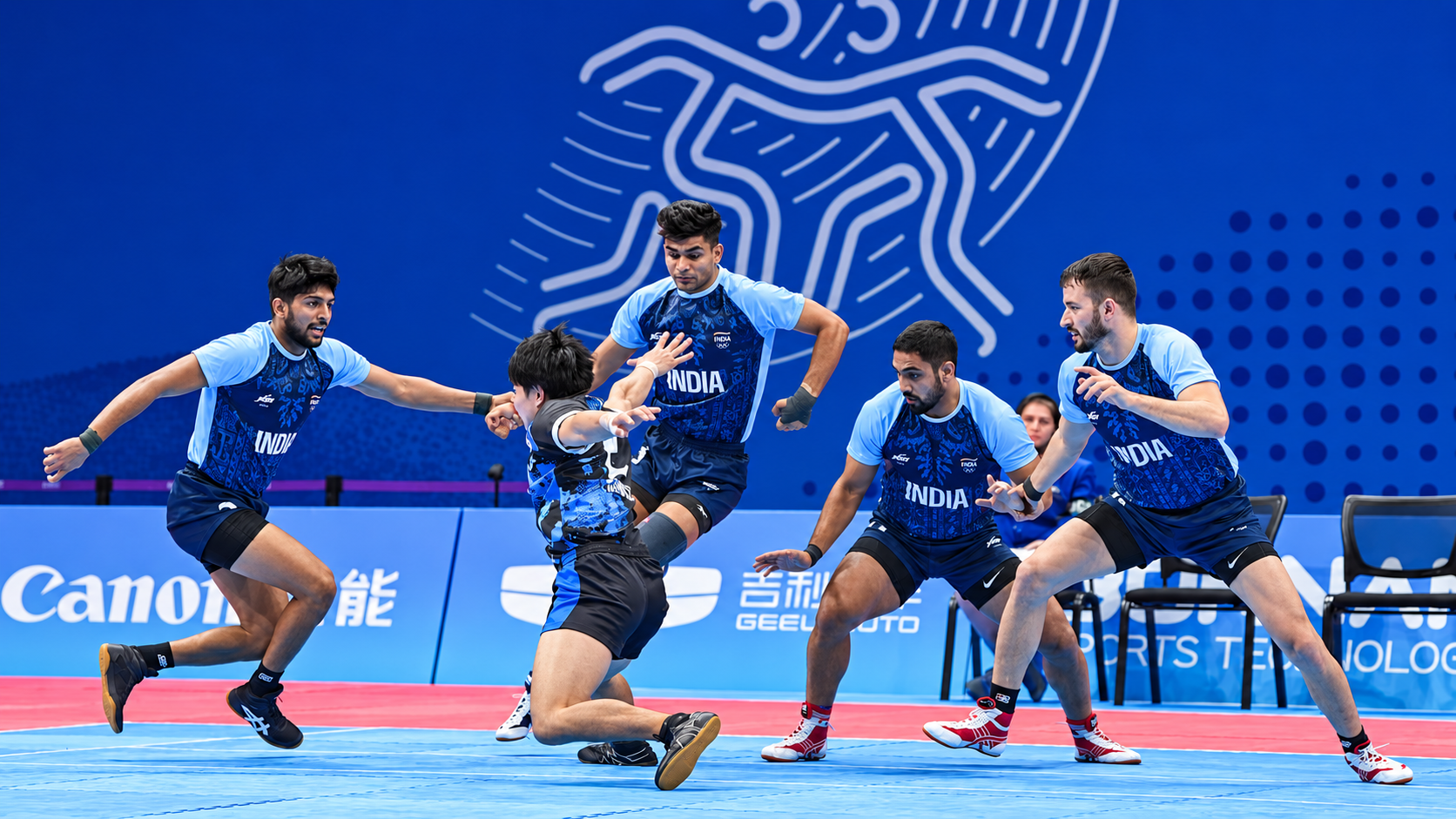 Indian men's kabaddi defenders surround an opposing raider during a match