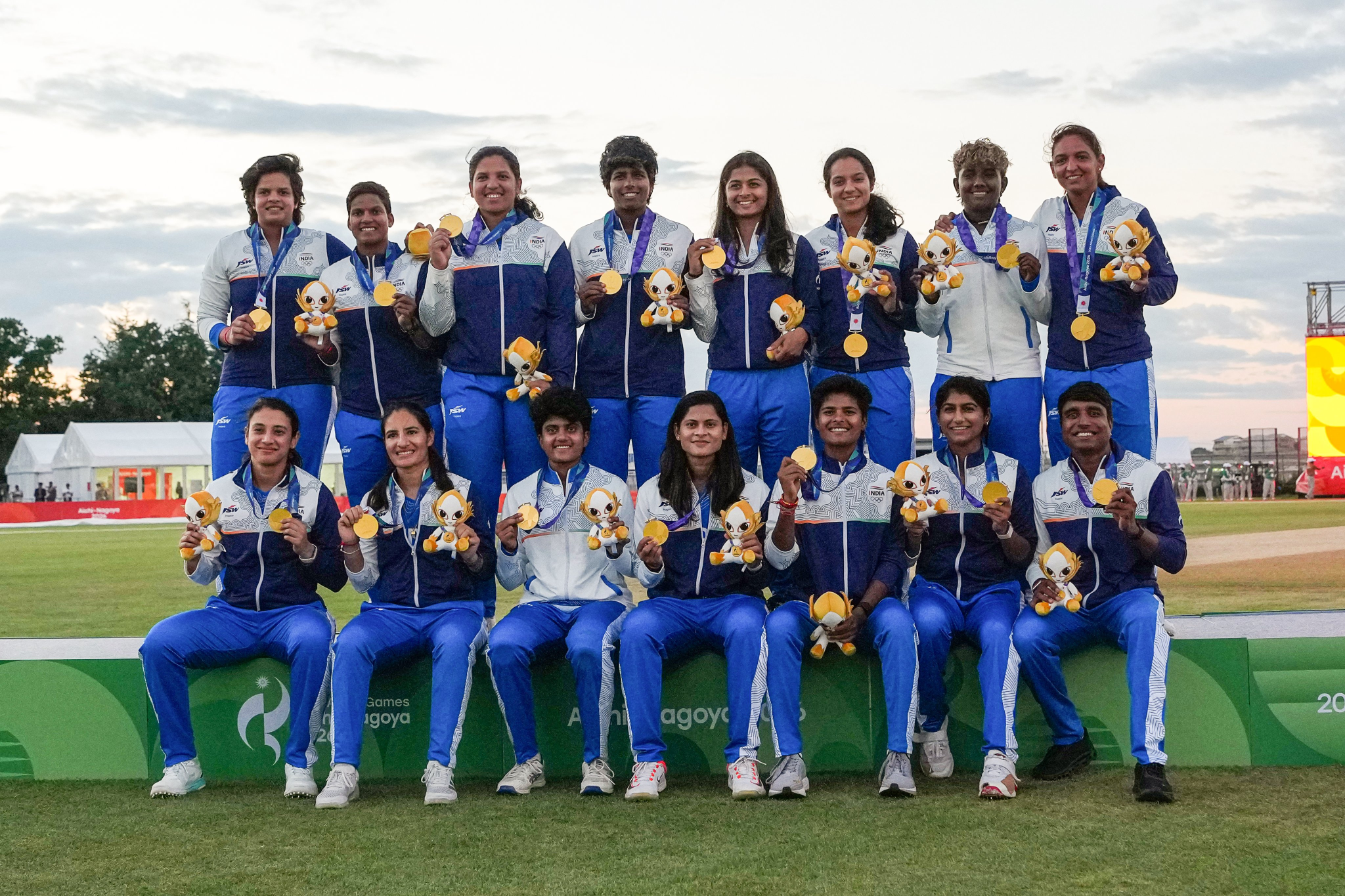 Asian Games 2026 Day 4: India Win First Gold, Two More Medals Assured Indian women's cricket team players posing with their gold medals after winning the Asian Games 2026 final