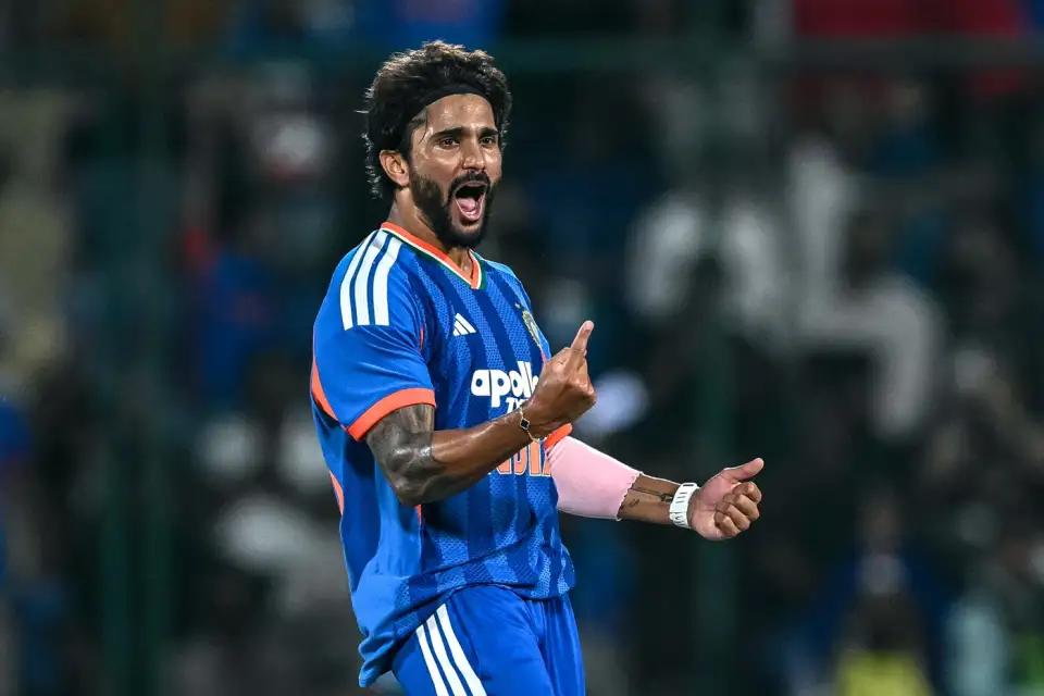 Nitish Kumar Reddy celebrates a wicket while wearing India's blue cricket kit