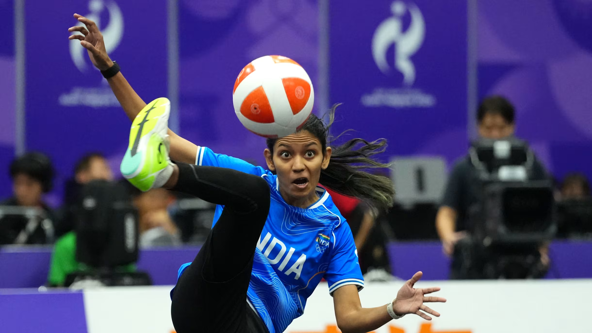 Indian teqball player Quimcy D'Souza performs an acrobatic kick during an Asian Games 2026 match