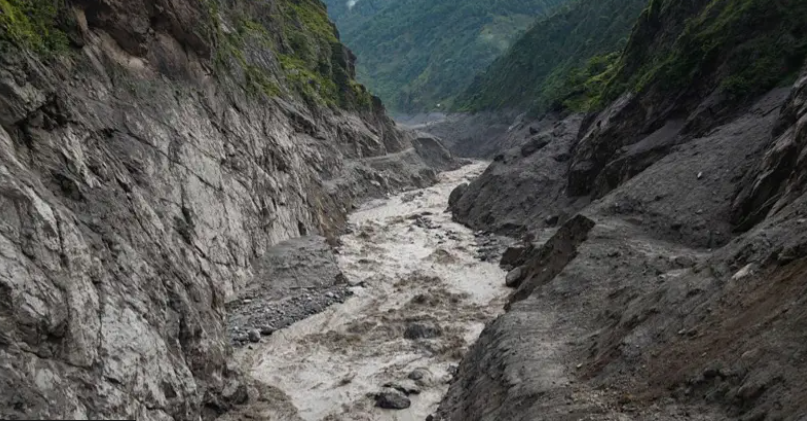 Muddy water rushes through the narrow, debris-covered Trishuli River gorge six days after the Nepal floods