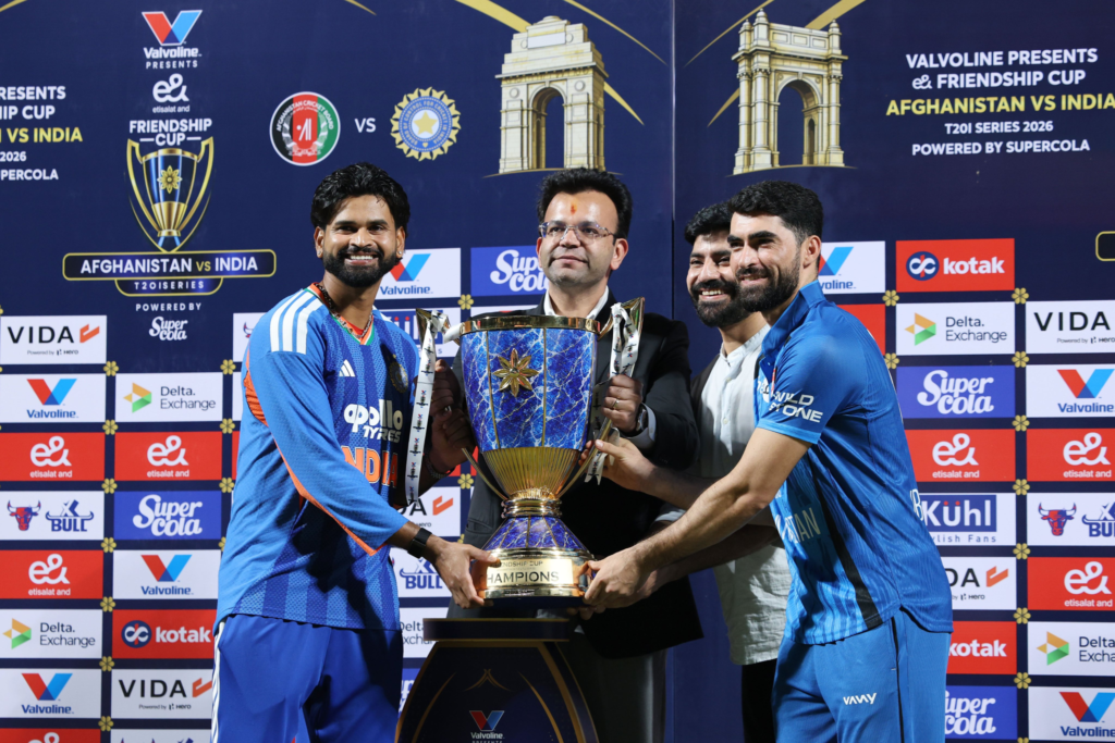 Abhishek Sharma’s 30-Ball Century Powers India to 3–0 Sweep of Afghanistan India captain Shreyas Iyer and Afghanistan captain Ibrahim Zadran smile while holding the Friendship Cup trophy with officials after the T20I series.