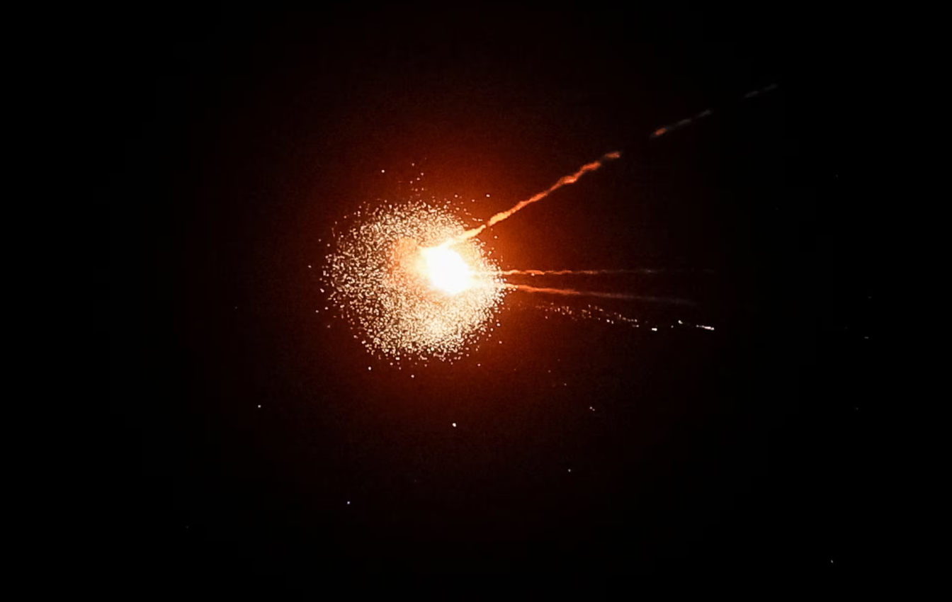 A Russian missile explodes in the night sky after being intercepted by Ukrainian air-defence forces over Kyiv
